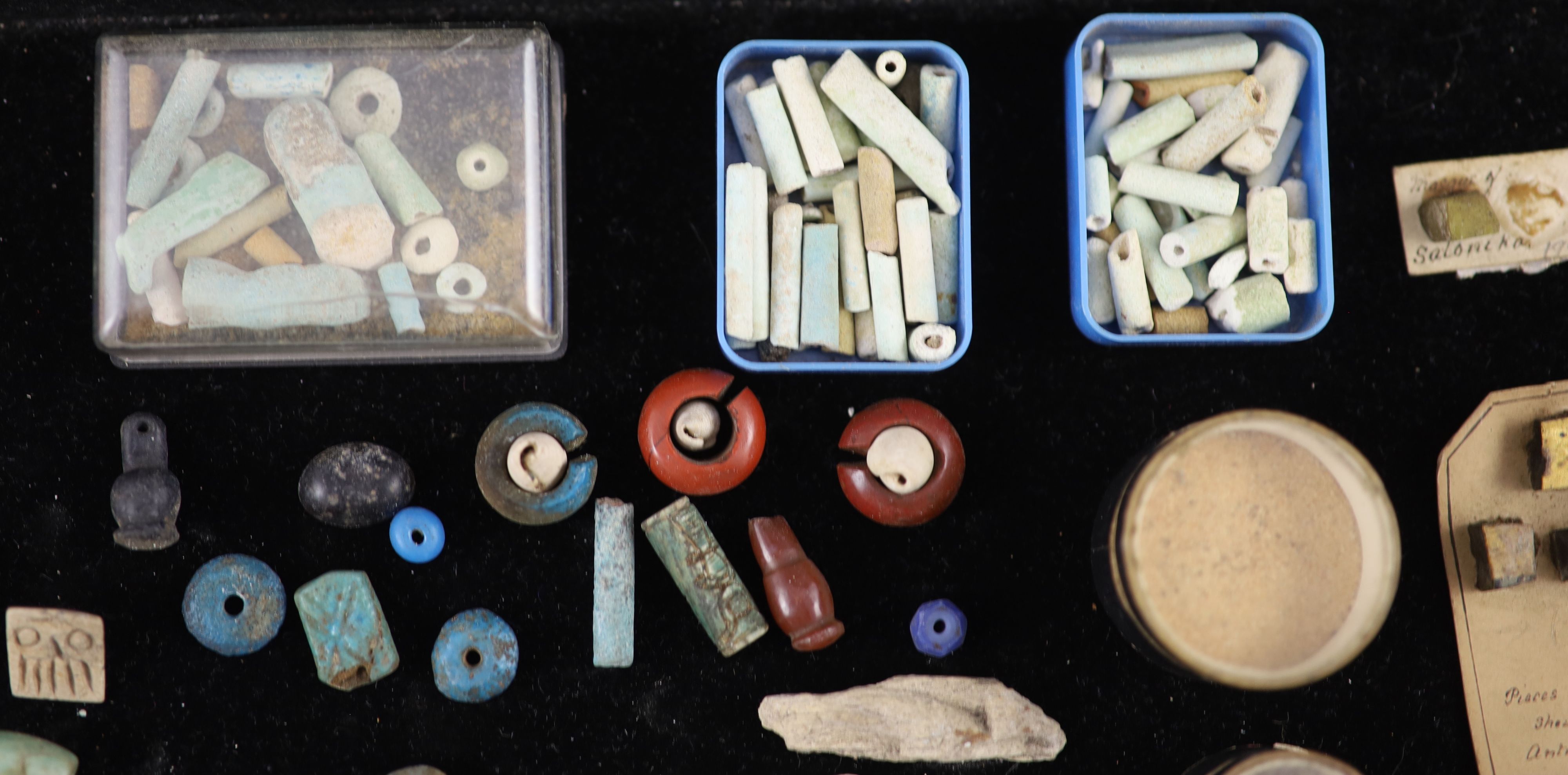 A group of Egyptian stone and turquoise glazed faience amulets, beads and fragments, late Kingdom to Roman period, Provenance - A. T. A